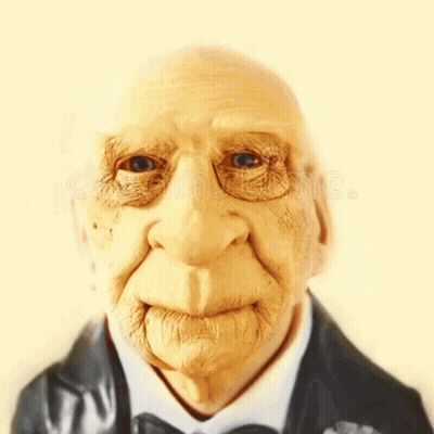 A Close Up Of An Elderly Man 'S Face Wearing A Suit And Bow Tie GIF