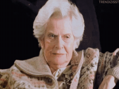 A Close Up Of An Elderly Woman 'S Face With The Words Trendizisst Written Below Her GIF