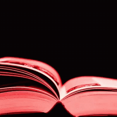 A Close Up Of An Open Book With Red Pages GIF
