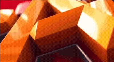 A Close Up Of An Orange And Black Geometric Shape GIF