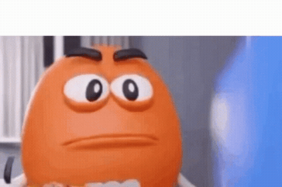 A Close Up Of An Orange Cartoon Character With Big Eyes And A Serious Face . GIF