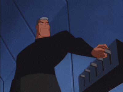 A Close Up Of Batman 'S Face With A Blue Background GIF