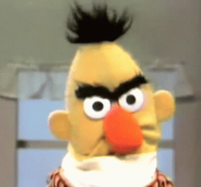 A Close Up Of Bert From Sesame Street With A Very Angry Look On His Face GIF