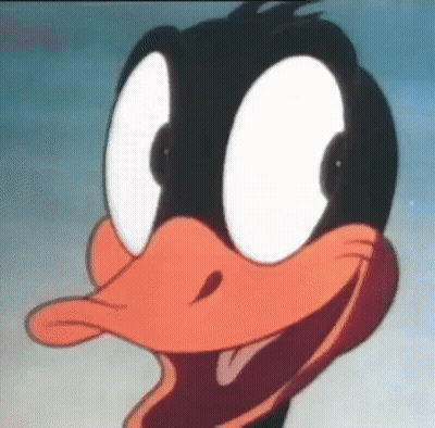A Close Up Of Daffy Duck 'S Face With Big White Eyes GIF