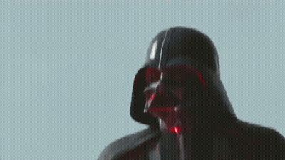 A Close Up Of Darth Vader 'S Face With A Red Background . GIF