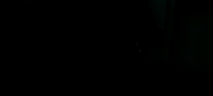 A Close Up Of Darth Vader 'S Skull In The Dark With A Knife In His Mouth . GIF
