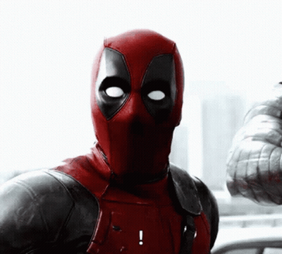 A Close Up Of Deadpool 'S Face With An Exclamation Mark GIF