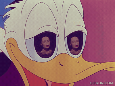 A Close Up Of Donald Duck 'S Face With Two Women Behind His Eyes GIF