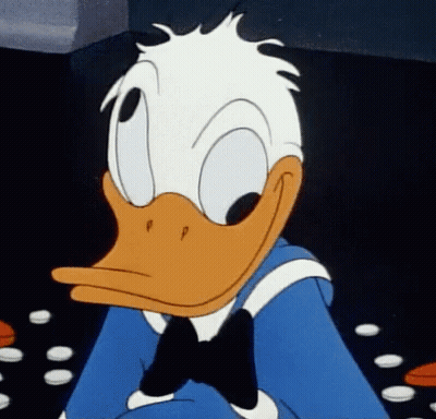 A Close Up Of Donald Duck Wearing A Blue Shirt And Bow Tie GIF