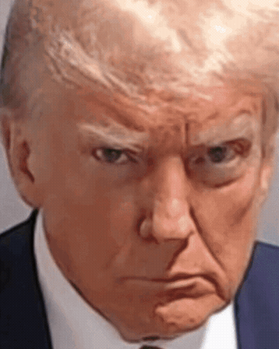 A Close Up Of Donald Trump 'S Face In A Suit And Tie Making An Angry Face . GIF