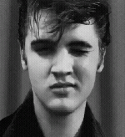 A Close Up Of Elvis Presley 'S Face In A Black And White Photo With His Eyes Closed . GIF