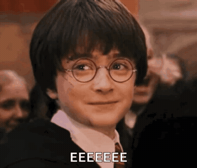 A Close Up Of Harry Potter Wearing Glasses And A Tie With The Words Eeeeee Written Below Him . GIF