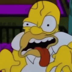 A Close Up Of Homer Simpson 'S Face With His Tongue Sticking Out GIF