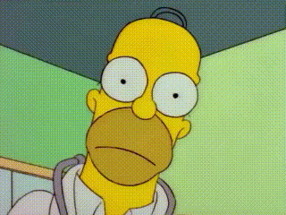 A Close Up Of Homer Simpson 'S Face With White Eyes GIF