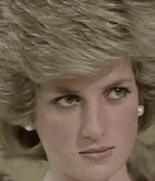 A Close Up Of Princess Diana 'S Face With Blonde Hair And Earrings . GIF