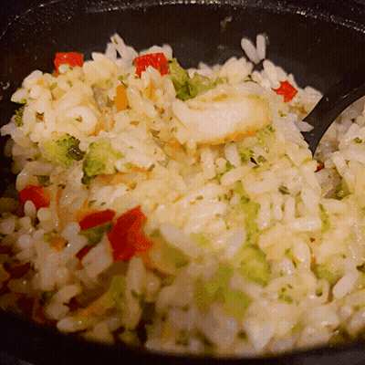 A Close Up Of Rice And Vegetables In A Bowl GIF