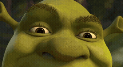 A Close Up Of Shrek 'S Face And Eyes GIF
