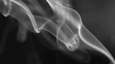A Close Up Of Smoke Coming Out Of A Pipe On A Black Background . GIF