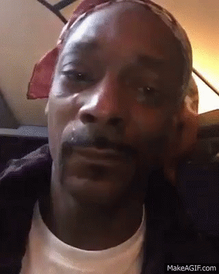 A Close Up Of Snoop Dogg 'S Face With A Bandana On His Head GIF