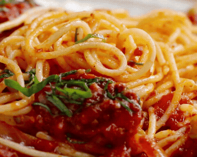 A Close Up Of Spaghetti With Tomato Sauce And Meatballs GIF