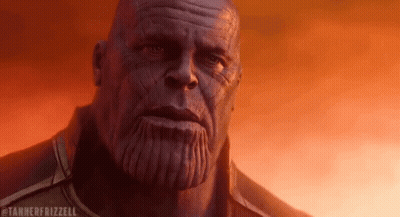 A Close Up Of Thanos ' Face With A Tanner Frizzell Watermark GIF