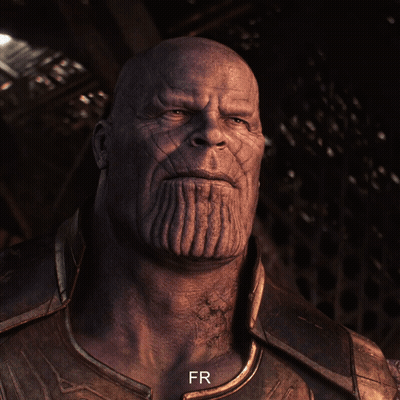 A Close Up Of Thanos ' Face With The Letters Fr Below Him GIF