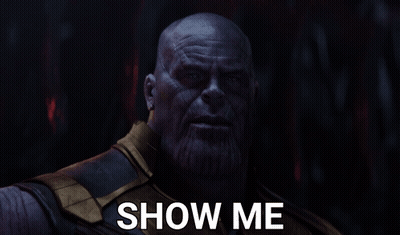 A Close Up Of Thanos With The Words Show Me Above Him GIF
