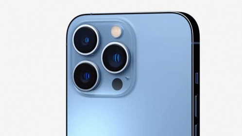 a close up of the back of a blue iphone 13 pro with three cameras .
