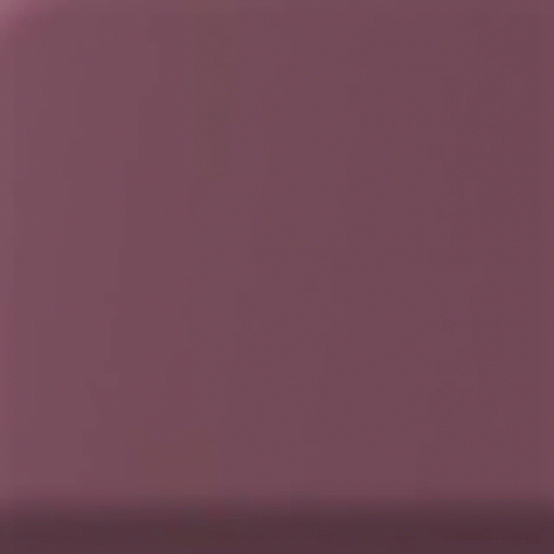 A Close Up Of The Back Of A Pink Cell Phone GIF