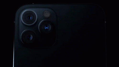 A Close Up Of The Back Of An Iphone With Three Cameras On It . GIF