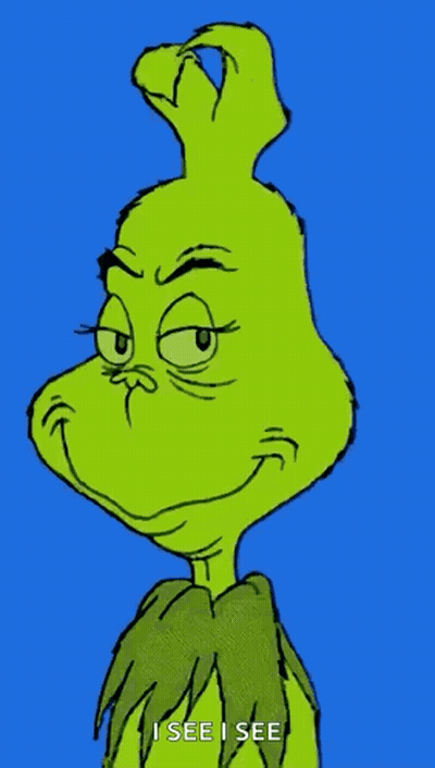 A Close Up Of The Grinch 'S Face With The Words `` I See I See '' Written Below It . GIF