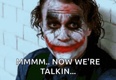 A Close Up Of The Joker 'S Face With The Words Mmmm Now We 'Re Talkin GIF