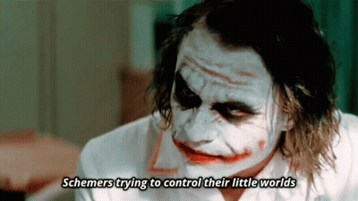 A Close Up Of The Joker With The Words Schemers Trying To Control Their Little Worlds Written Below Him GIF