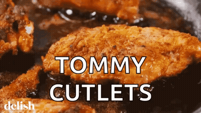 A Close Up Of Tommy Cutlets In A Pan GIF