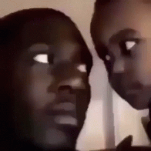 A Close Up Of Two People 'S Faces With Their Eyes Closed . GIF