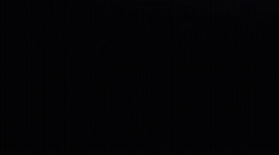 A Close Up Of Venom 'S Face With Sharp Teeth In The Dark . GIF