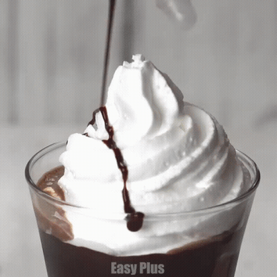A Close Up Of Whipped Cream With Easy Plus Written In The Bottom Right Corner GIF