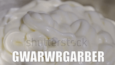 A Close Up Of Whipped Cream With The Words Gwarwrgarber On It GIF