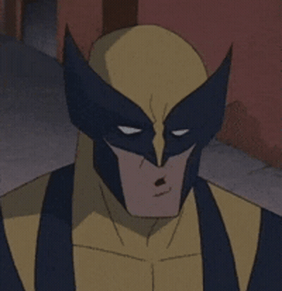 A Close Up Of Wolverine 'S Face With A Serious Look On His Face GIF