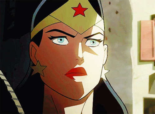 A Close Up Of Wonder Woman 'S Face With A Red Star On Her Hat GIF