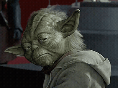 A Close Up Of Yoda Wearing A Hoodie With A Sad Look On His Face GIF