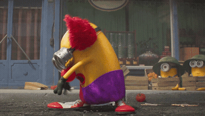 A Clown Is Holding A Chainsaw In Front Of A Salle 'S Store GIF