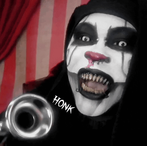 A Clown Is Holding A Trumpet With Honk Written On The Sleeve GIF