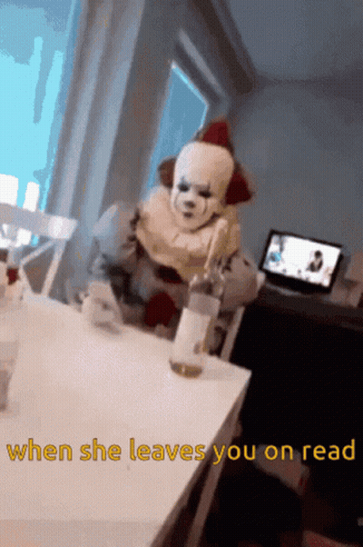 A Clown Is Sitting At A Table With A Bottle Of Wine And The Words " When She Leaves You On Read " GIF