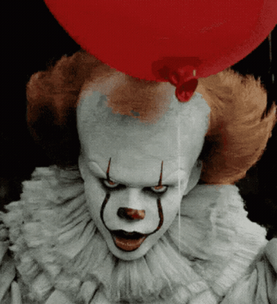A Clown With A Red Balloon On His Head GIF