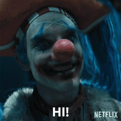 A Clown With A Red Nose Is Smiling And Says Hi On The Bottom GIF