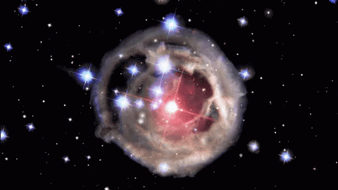 A Cluster Of Stars Are Surrounded By A Cloud Of Dust GIF