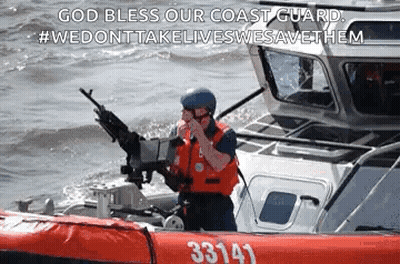 A Coast Guard Officer Is Standing On A Boat In The Water Holding A Gun . GIF