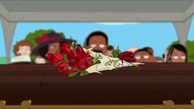 A Coffin With A Bouquet Of Red Roses Laying On It GIF