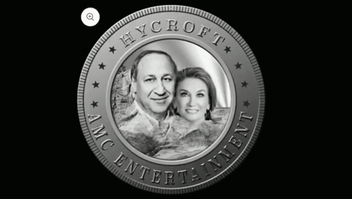 A Coin That Says Hycroft Amc Entertainment With A Picture Of A Man And Woman GIF